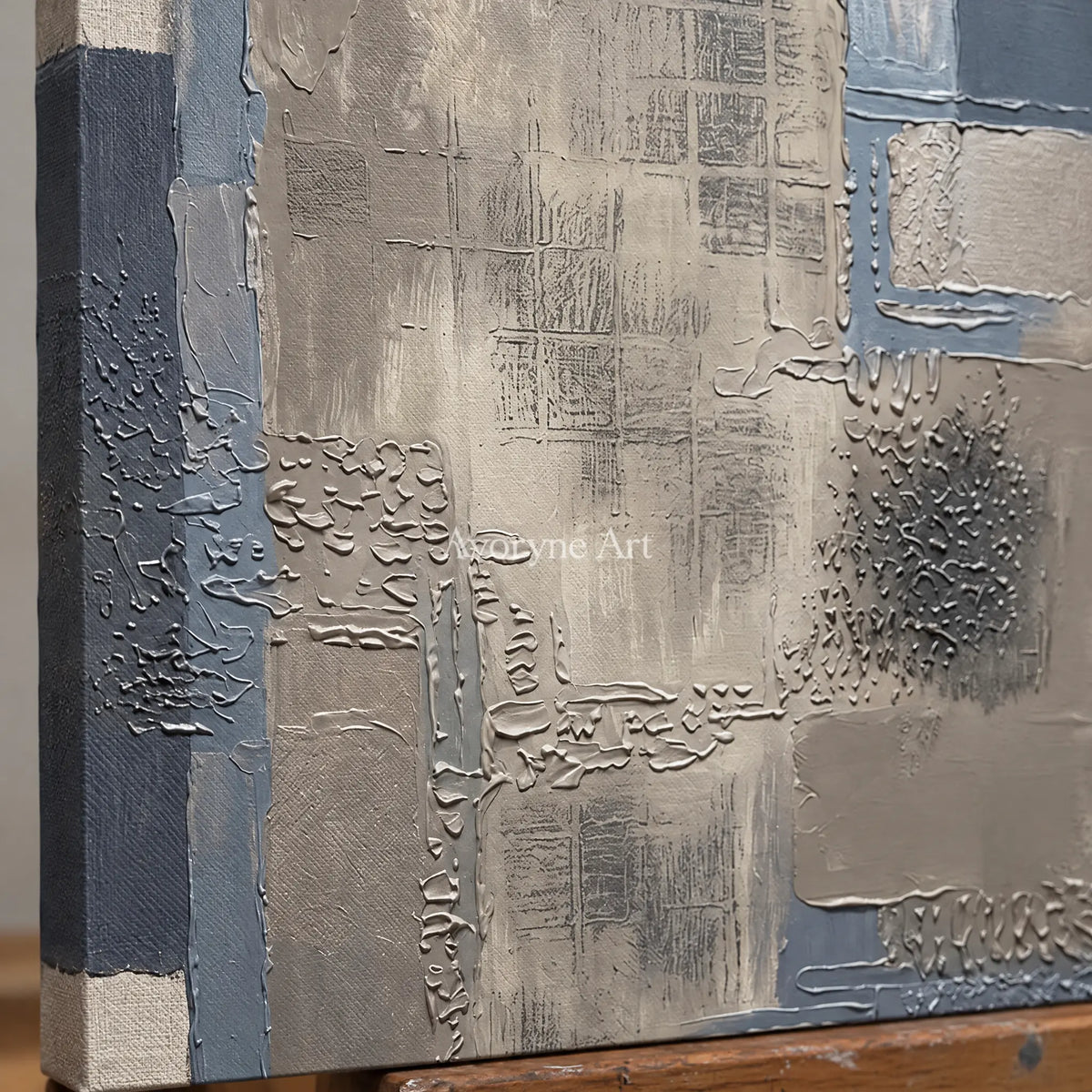 Close-up of the hand-painted texture of Amber Echo block relief wall art on an easel