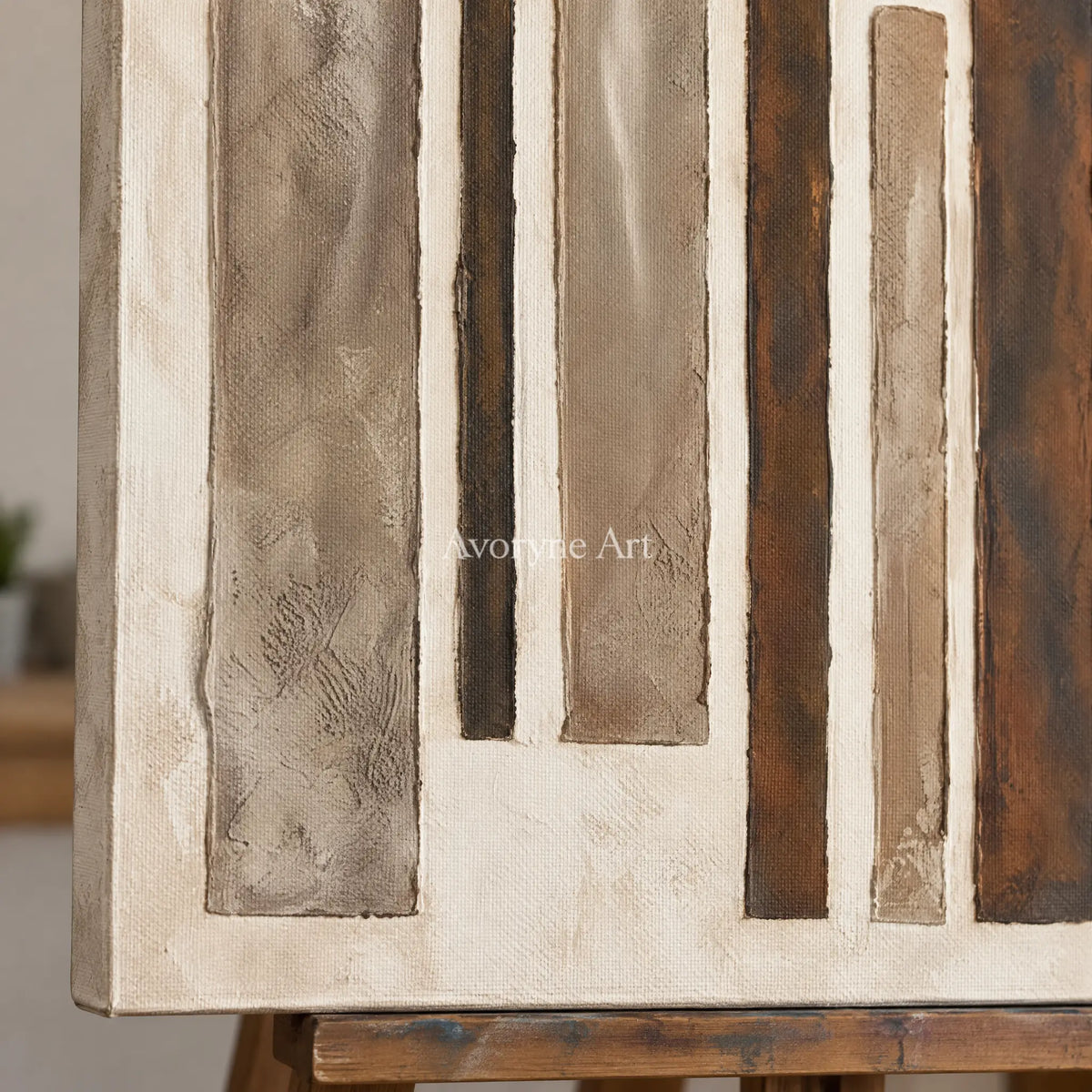 Close-up of the hand-painted texture of Soft Echo block relief wall art on an easel