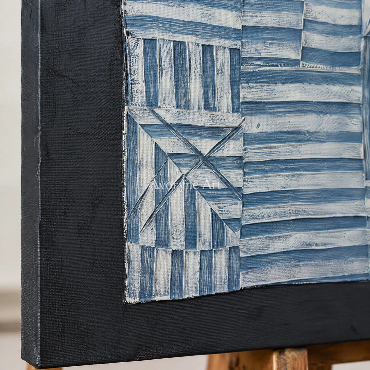 Close-up of the hand-painted texture of Mineral Refrain blue geometric texture wall art on an easel