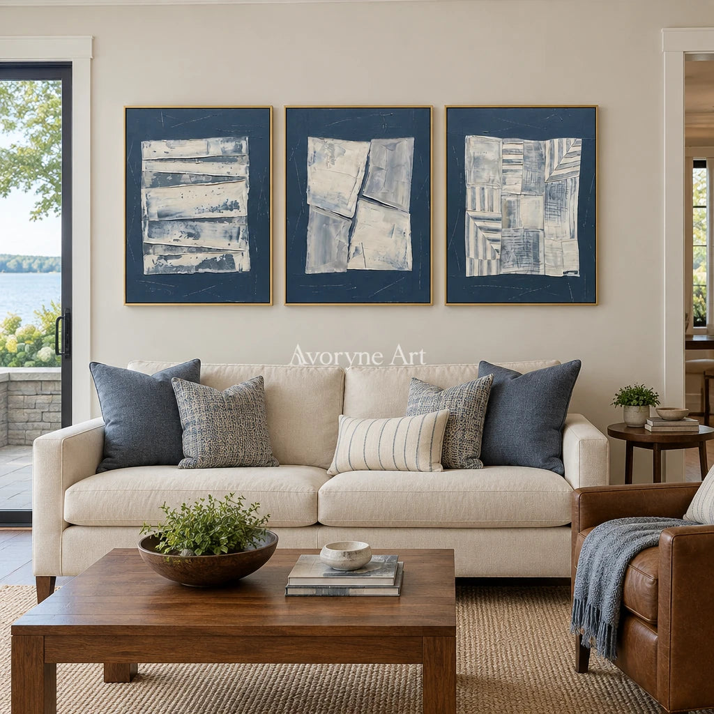 Hushed Solace blue geometric texture triptych with a gold frame hanging in a living room