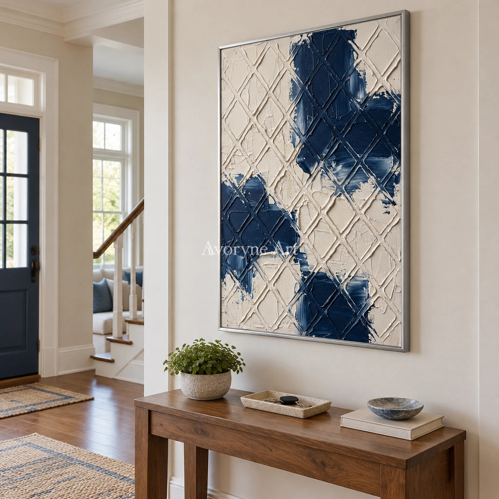 Weathered Current blue ivory grid wall art with a silver frame in an entryway
