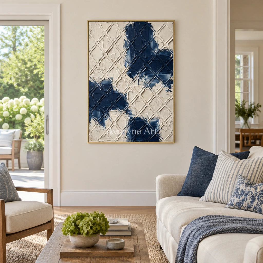 Weathered Current blue ivory grid wall art with a gold frame hanging in a living room