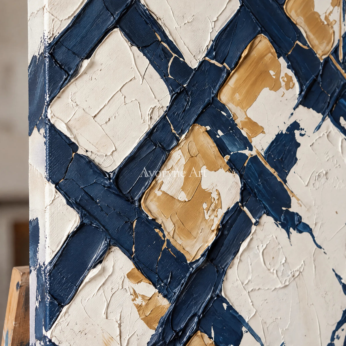 Close-up of the hand-painted texture of Earthen Refrain blue ivory grid wall art on an easel