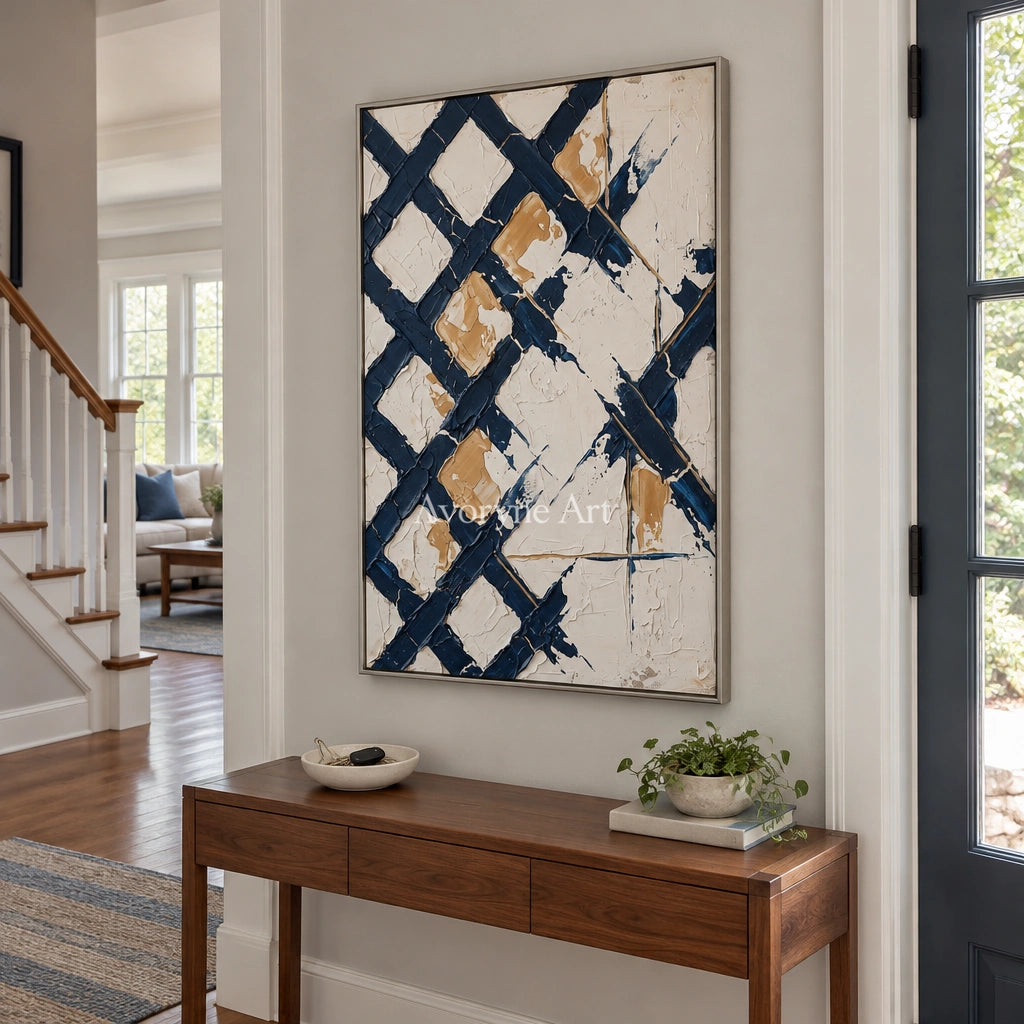 Earthen Refrain blue ivory grid wall art with a silver frame in an entryway