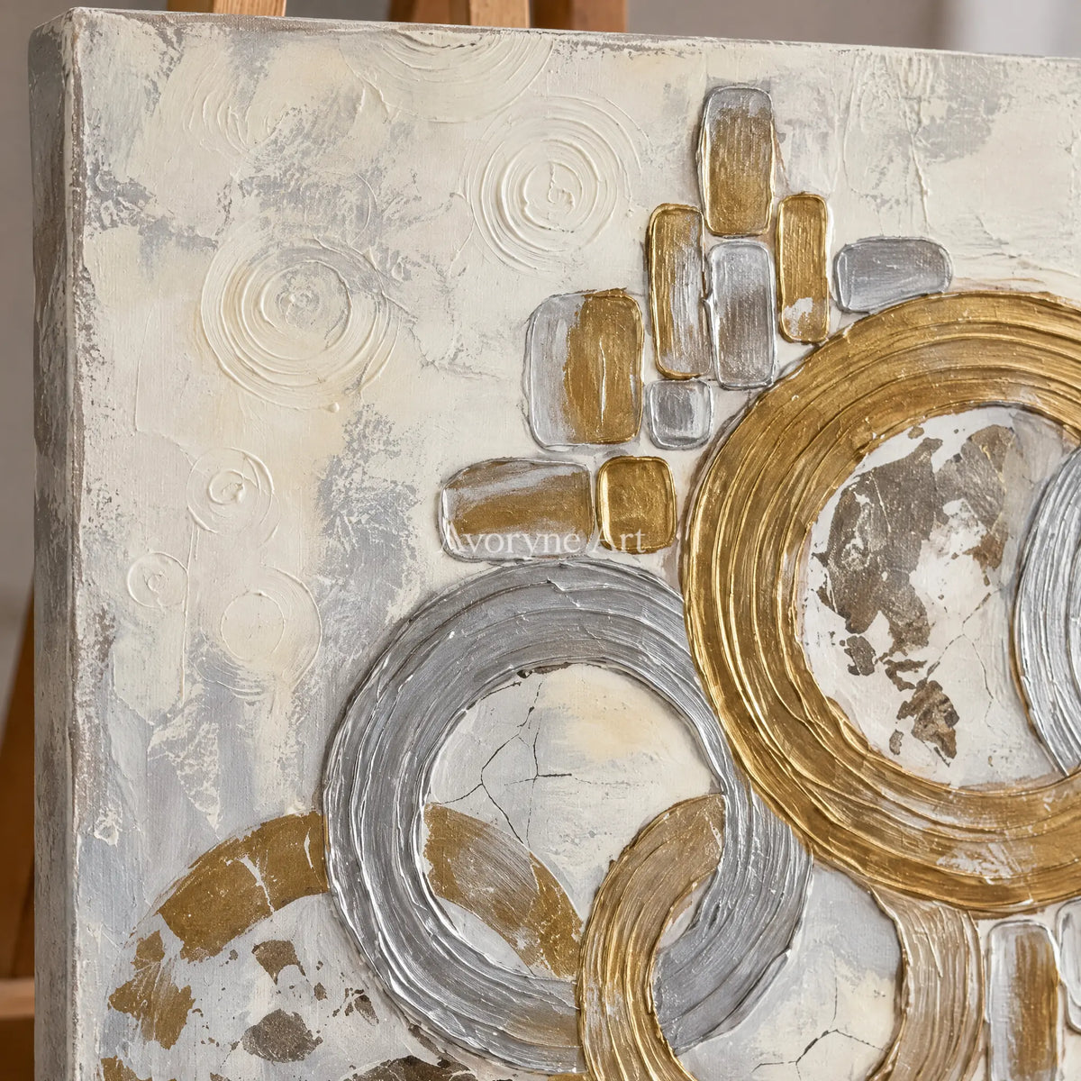 Close-up of the hand-painted texture of Soft Gesture circle relief wall art on an easel