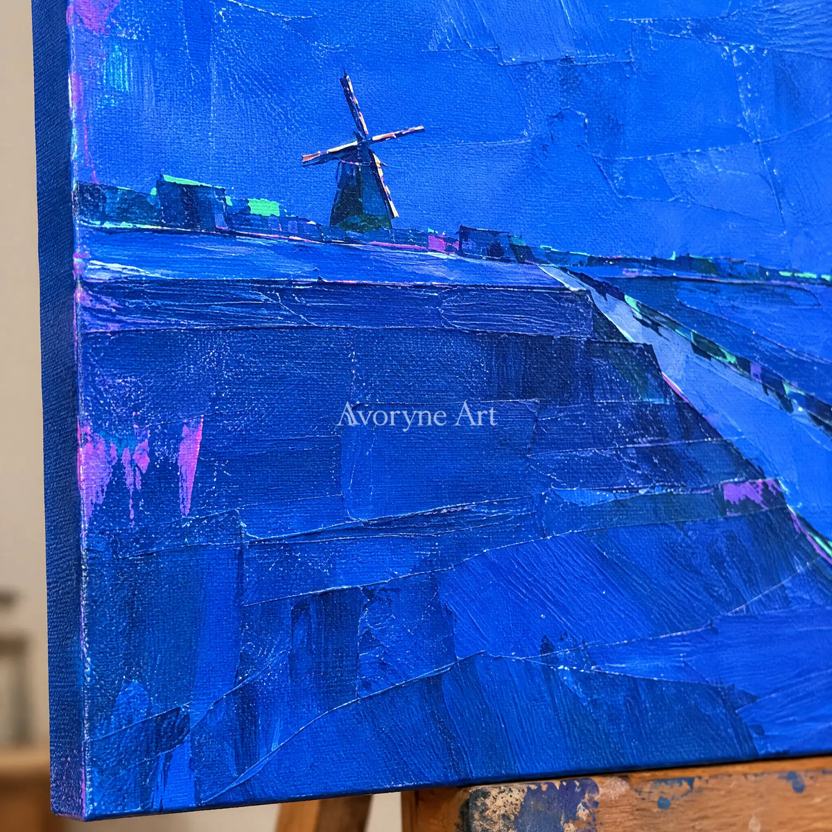 Close-up of the hand-painted texture of Tender Verse cityscape wall art on an easel