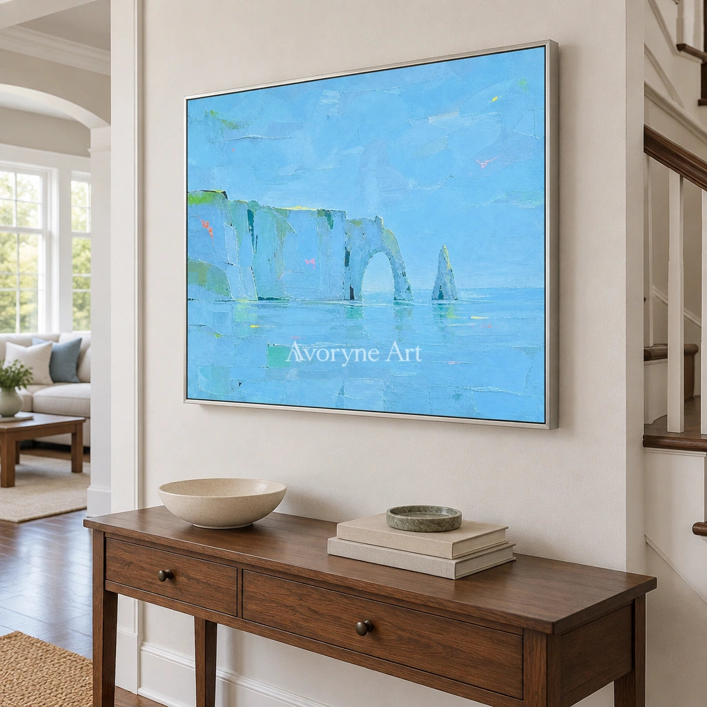 Tender Drift coastal landscape wall art with a silver frame in an entryway