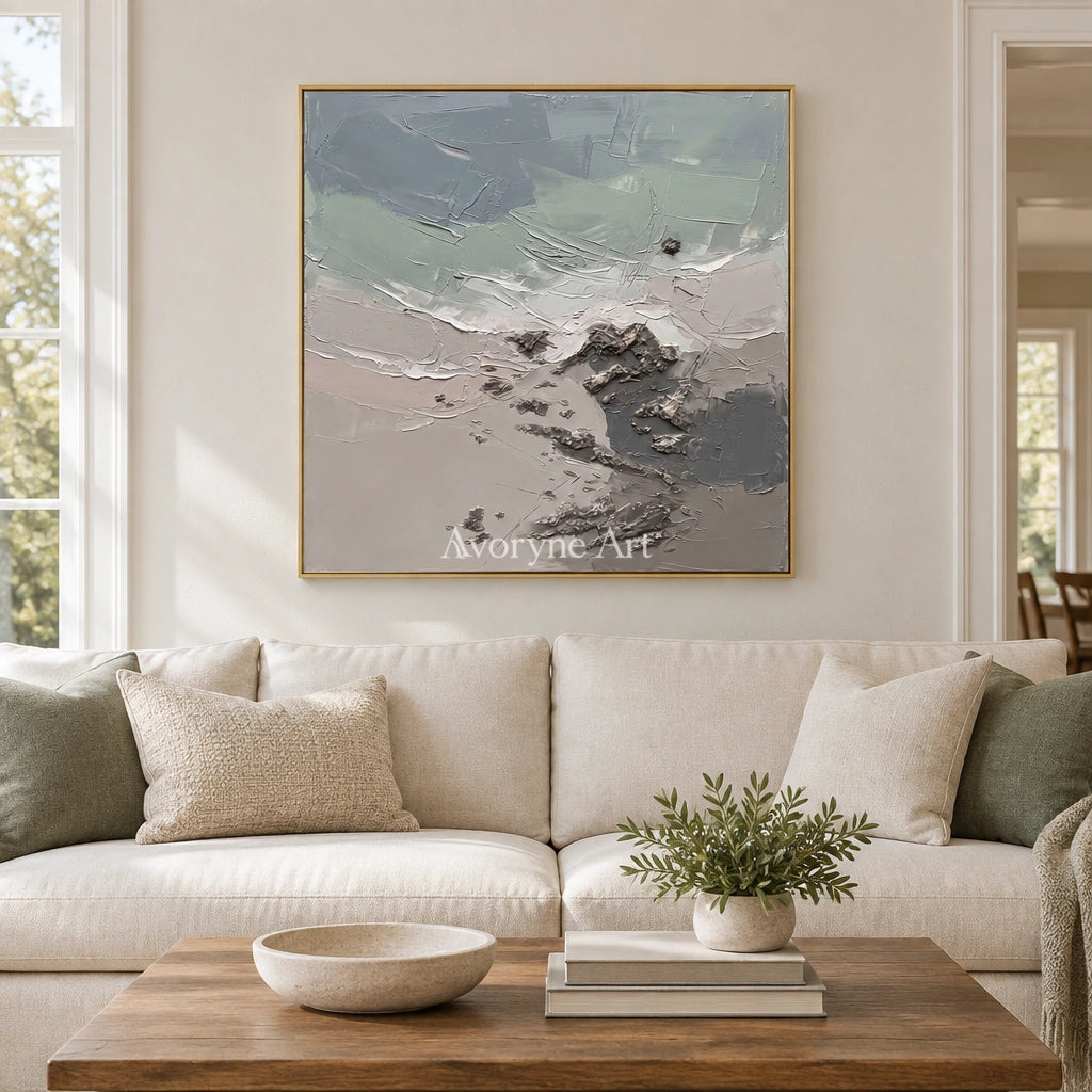 Restful Gesture coastal landscape wall art with a gold frame hanging in a living room