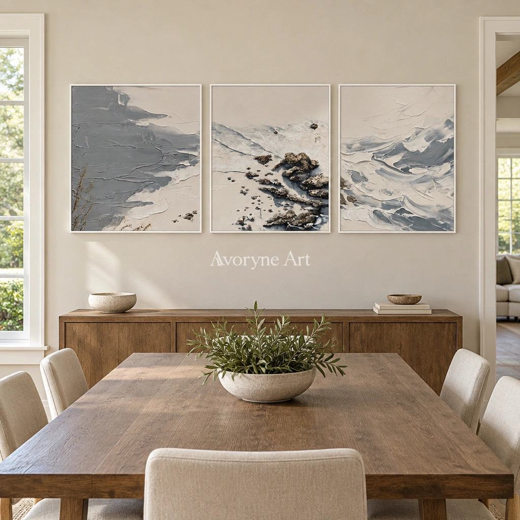 Restful Reverie coastal landscape triptych with a white frame in a dining room