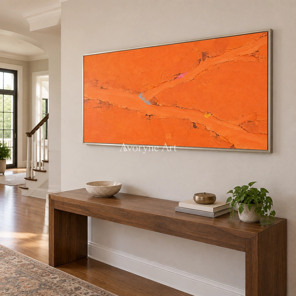 Still Echo color block landscape wall art with a silver frame in an entryway