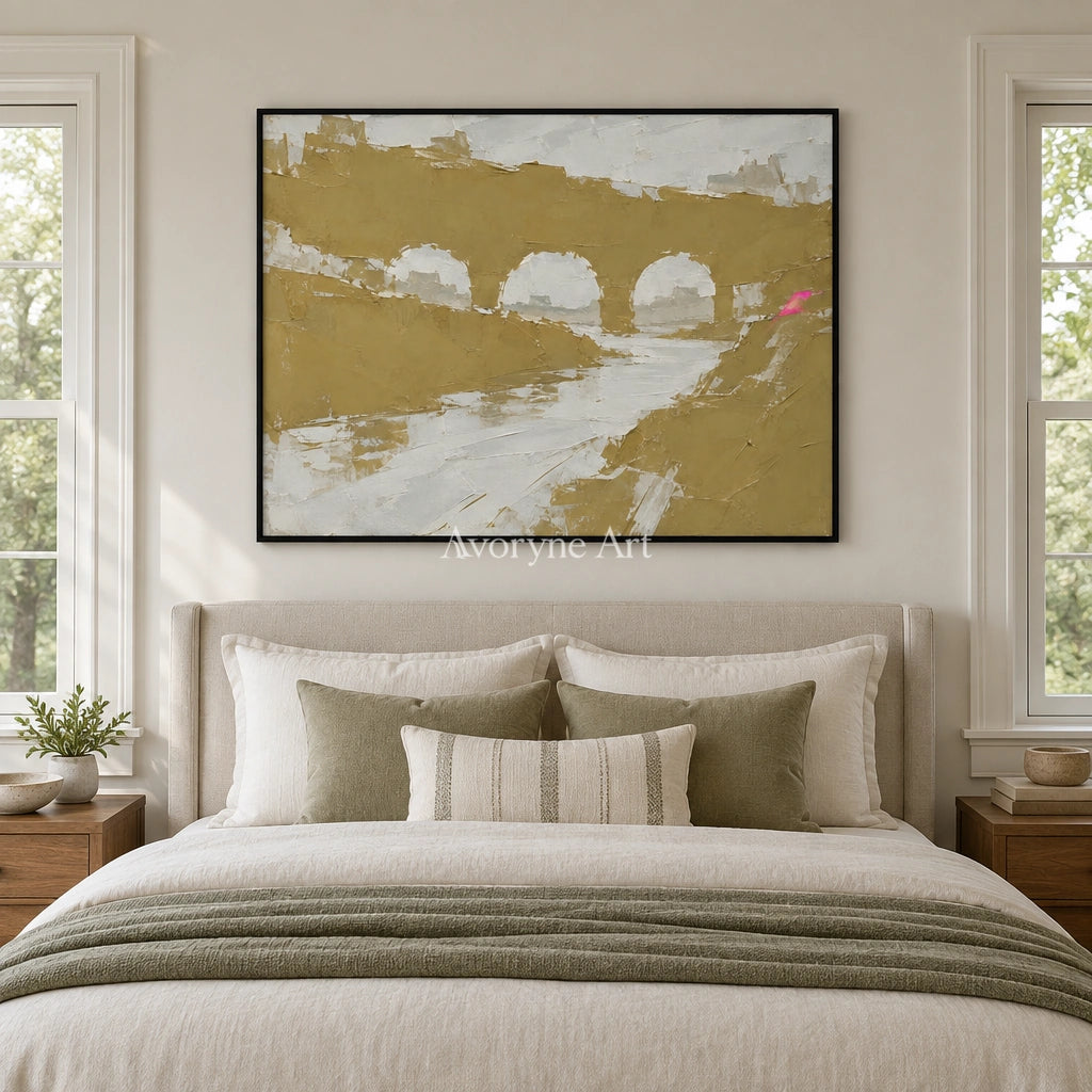 Still Memory color block landscape wall art with a black frame above a bed in a bedroom