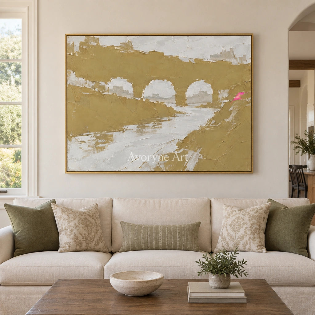 Still Memory color block landscape wall art with a gold frame hanging in a living room