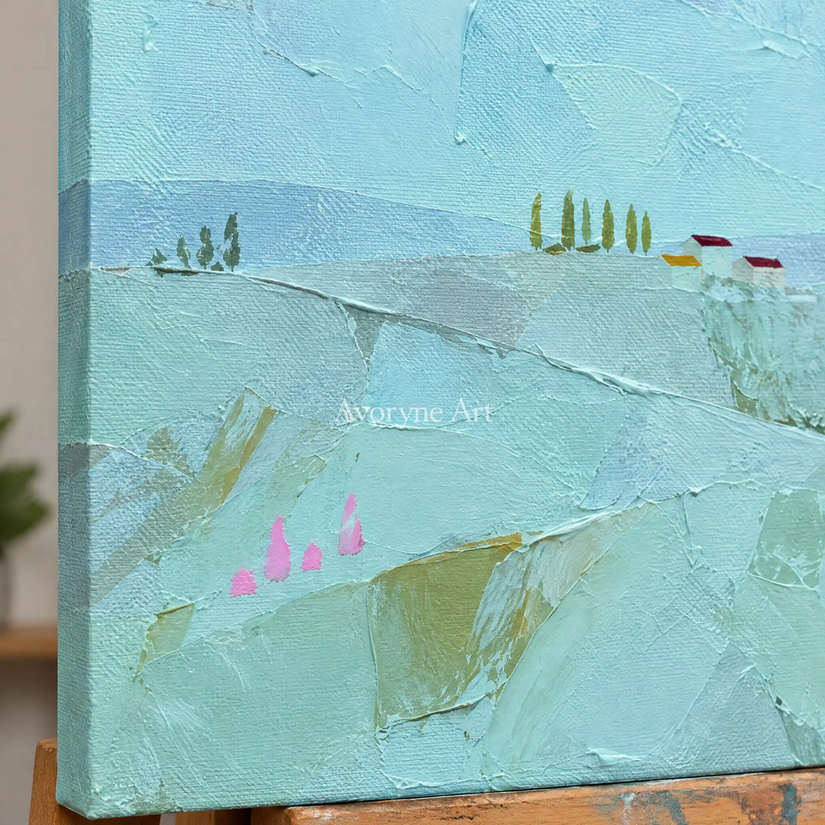 Close-up of the hand-painted texture of Still Story color block landscape wall art on an easel