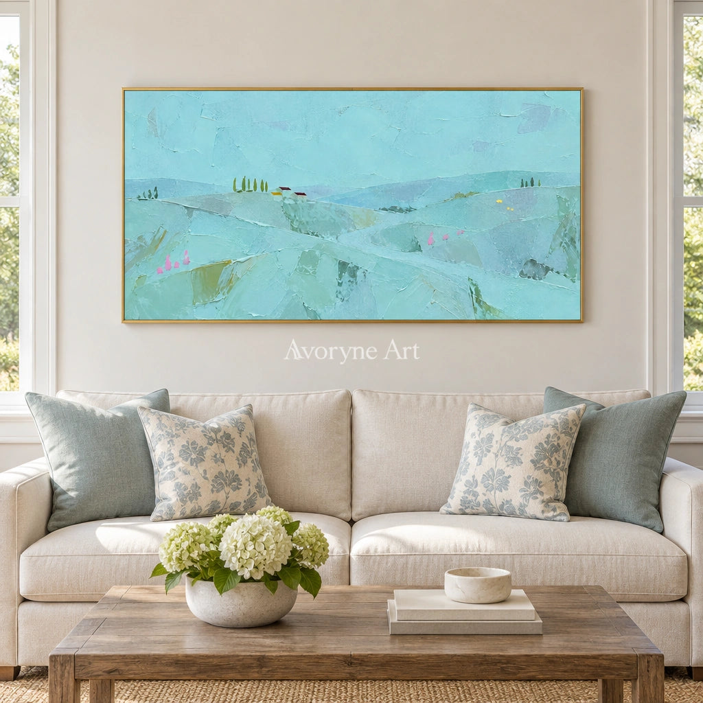 Still Story color block landscape wall art with a gold frame hanging in a living room