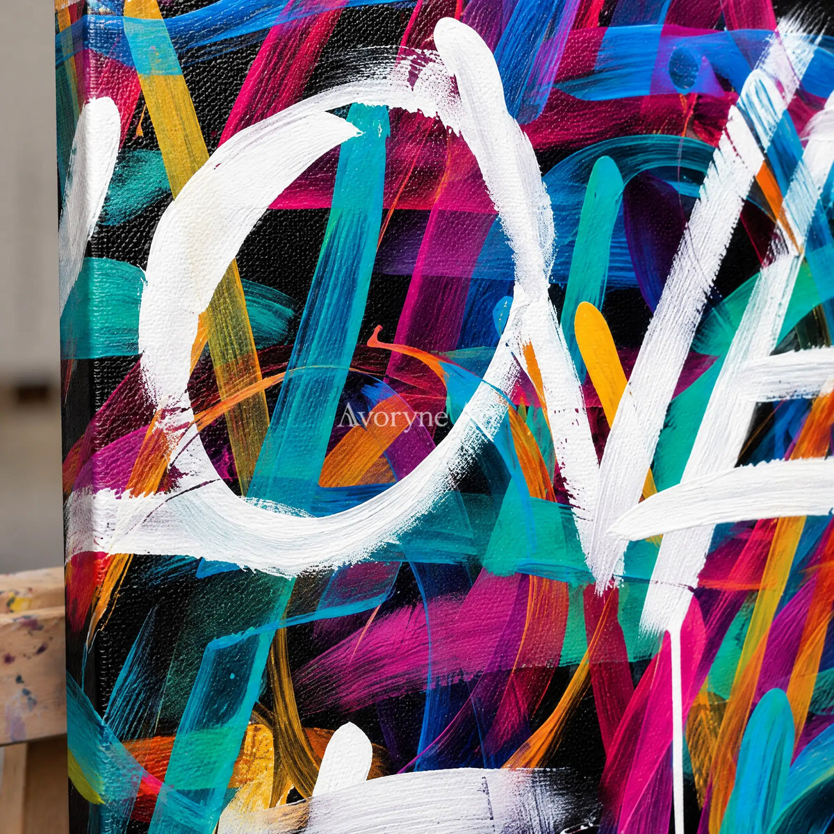 Close-up of the hand-painted texture of Hidden Verse colorful love wall art on an easel