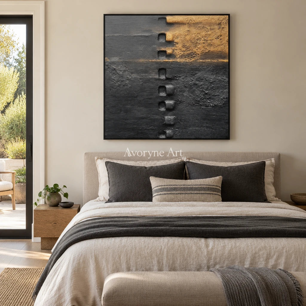 Quiet Refrain dark mineral relief wall art with a black frame above a bed in a bedroom