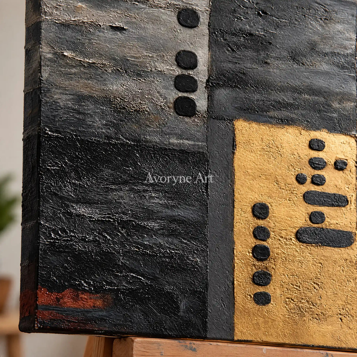 Close-up of the hand-painted texture of Quiet Field dark mineral relief wall art on an easel