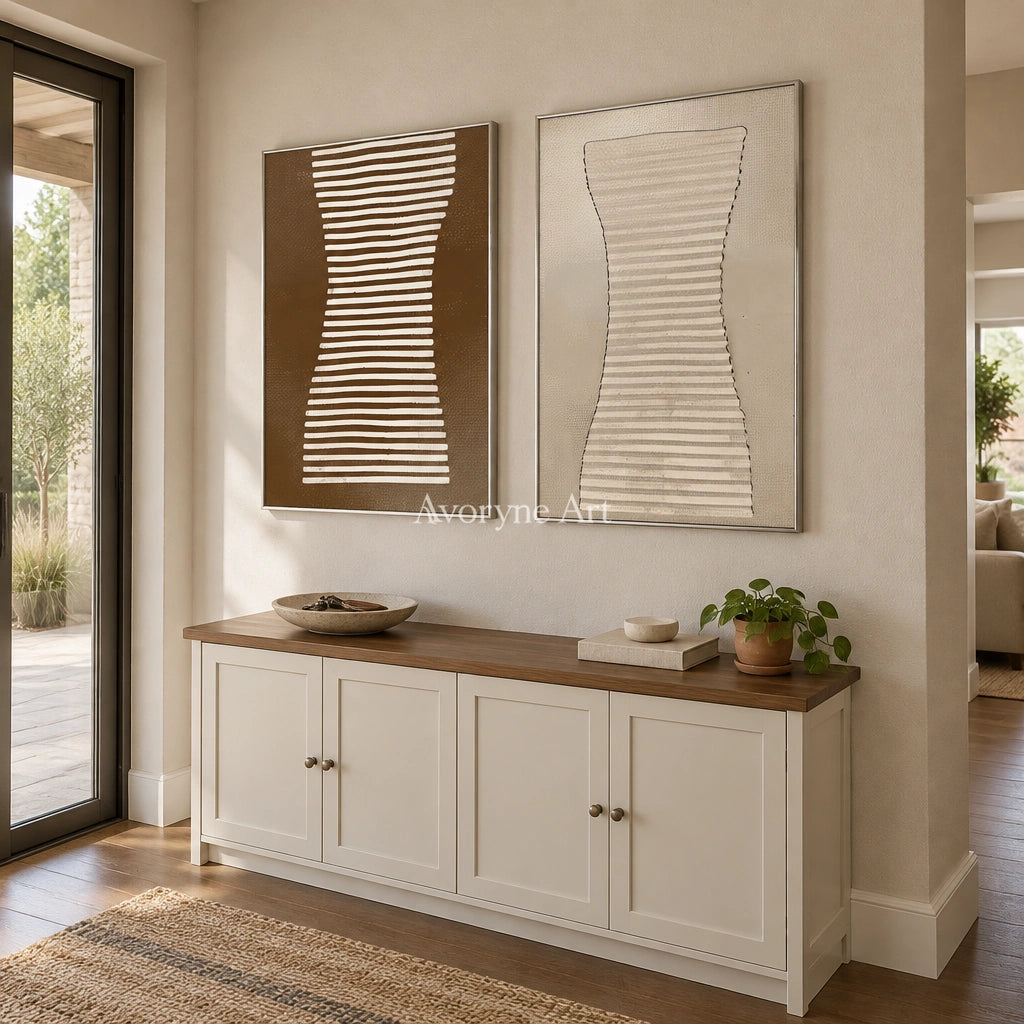 Muted Haven earth grooved curves diptych with a silver frame in an entryway