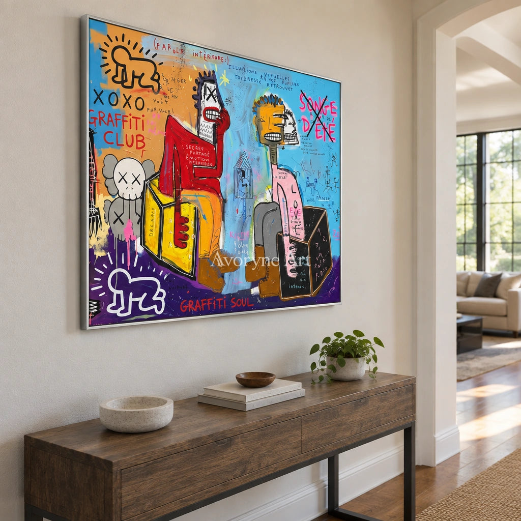 Hidden Gesture graffiti figure wall art with a silver frame in an entryway