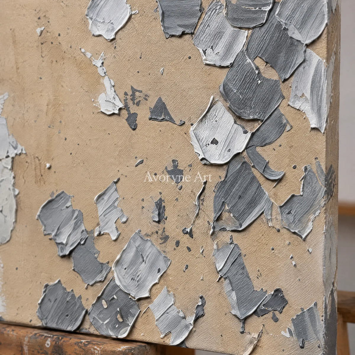 Close-up of the hand-painted texture of Mineral Trace gray curl relief triptych on an easel