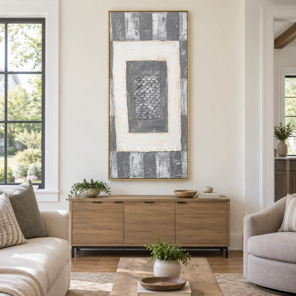 Hushed Memory gray scale relief wall art with a gold frame hanging in a living room