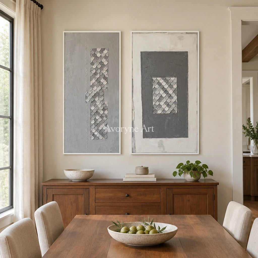 Hushed Reverie gray scale relief diptych with a white frame in a dining room