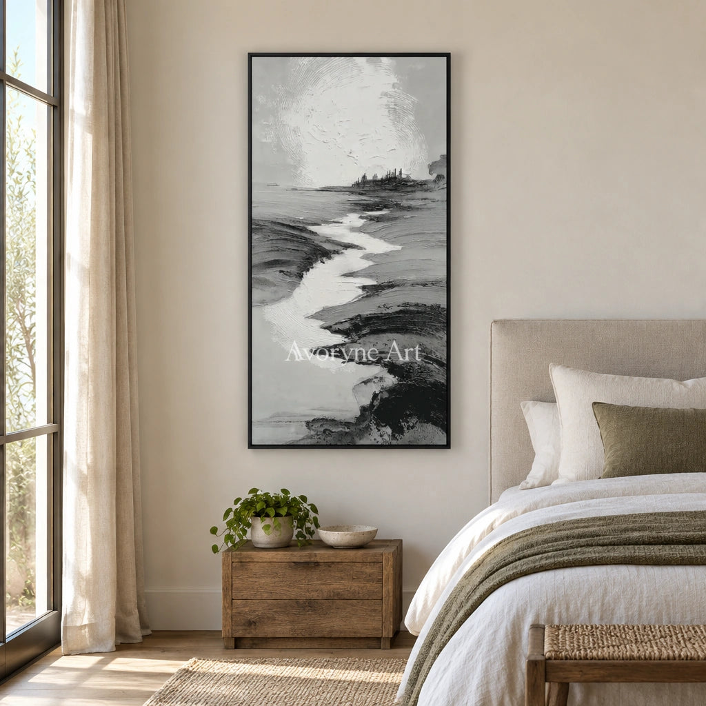 Pale Measure gray water landscape wall art with a black frame above a bed in a bedroom