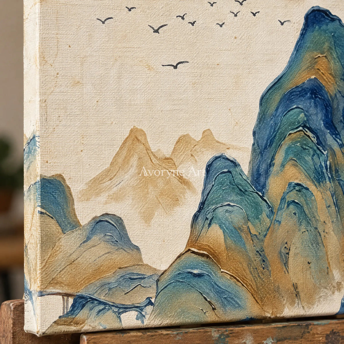 Close-up of the hand-painted texture of Faint Horizon green mountain diptych on an easel