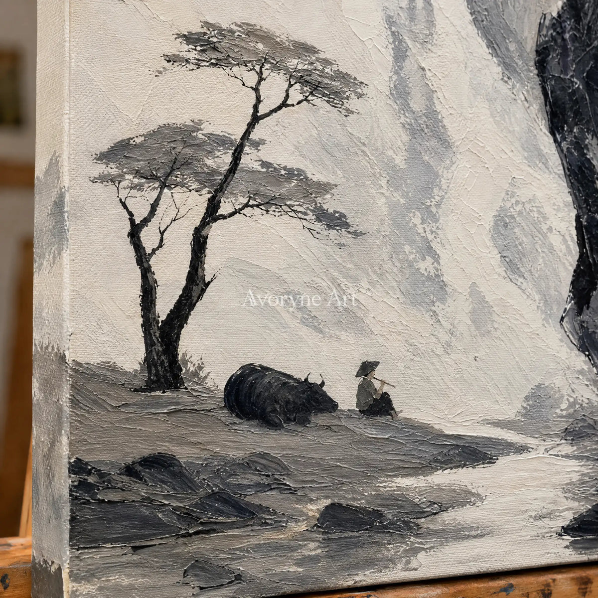 Close-up of the hand-painted texture of Misted Trace ink mountain pine wall art on an easel
