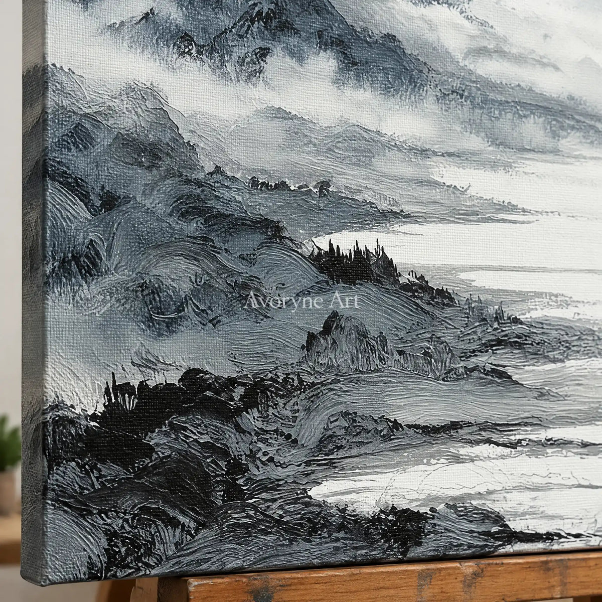Close-up of the hand-painted texture of Pale Haven ink mountain water wall art on an easel