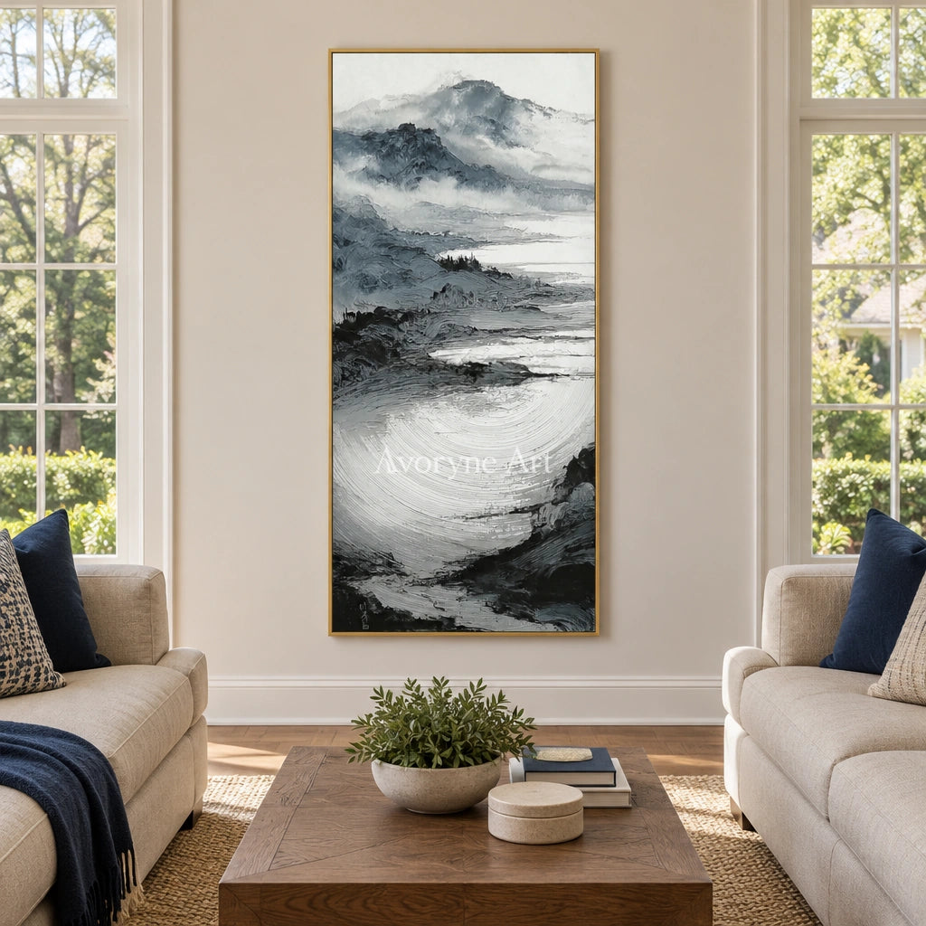 Pale Haven ink mountain water wall art with a gold frame hanging in a living room