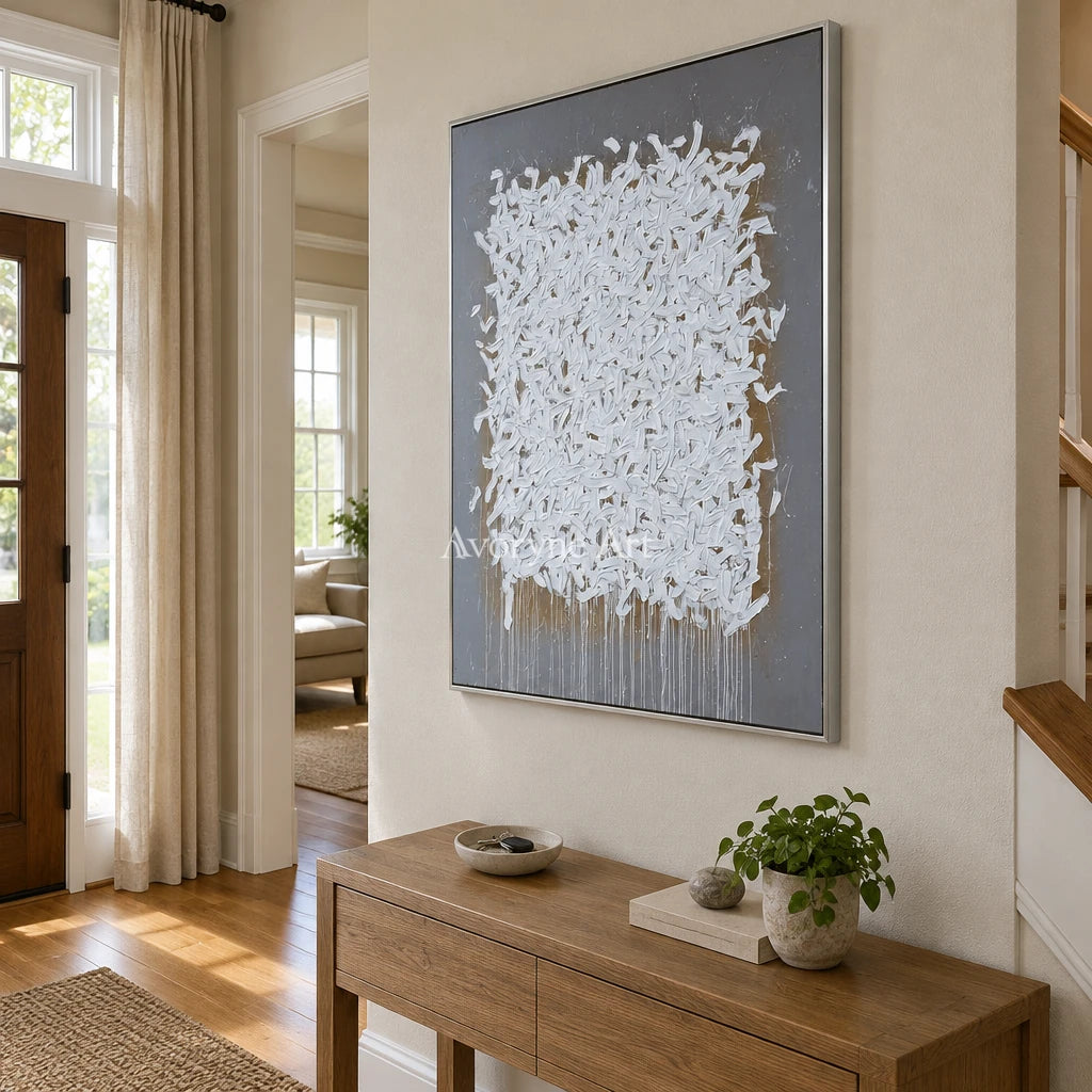 Lucent Field ivory curl relief wall art with a silver frame in an entryway
