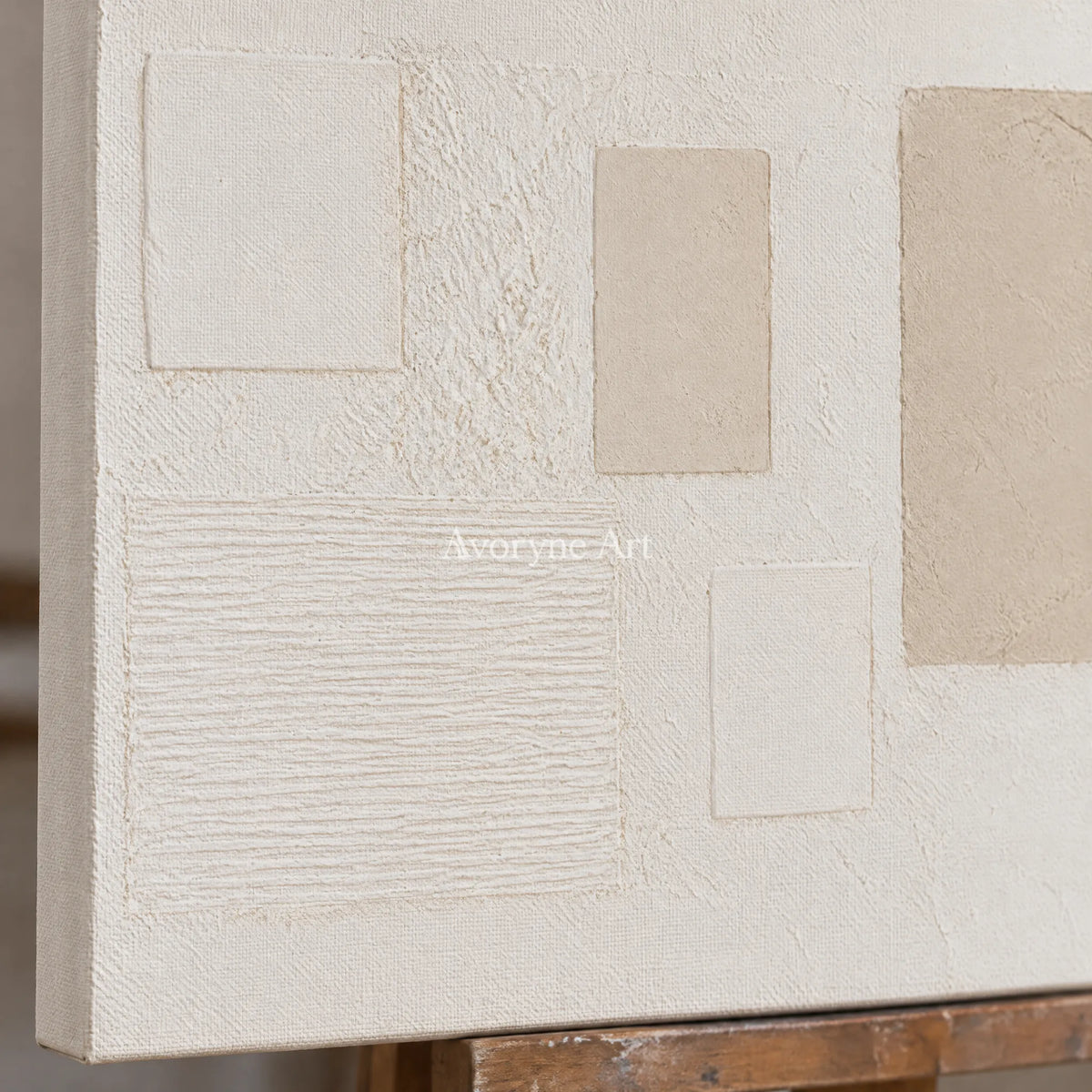 Close-up of the hand-painted texture of Woven Current ivory geometric art on an easel