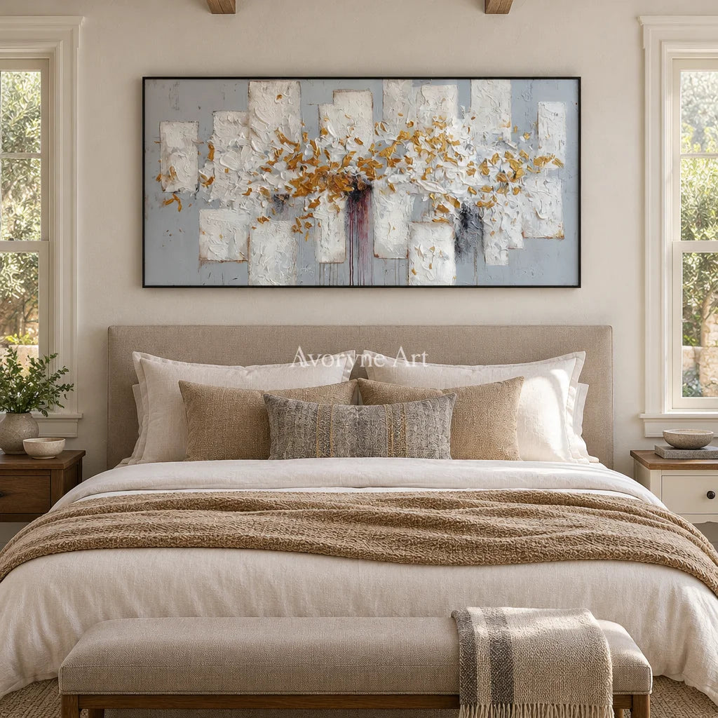 Gentle Field ivory gold relief wall art with a black frame above a bed in a bedroom