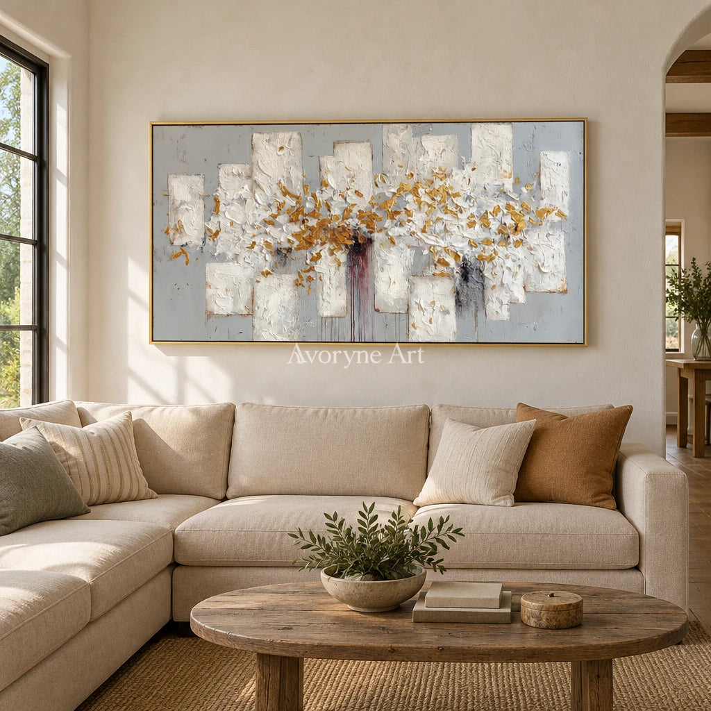 Gentle Field ivory gold relief wall art with a gold frame hanging in a living room