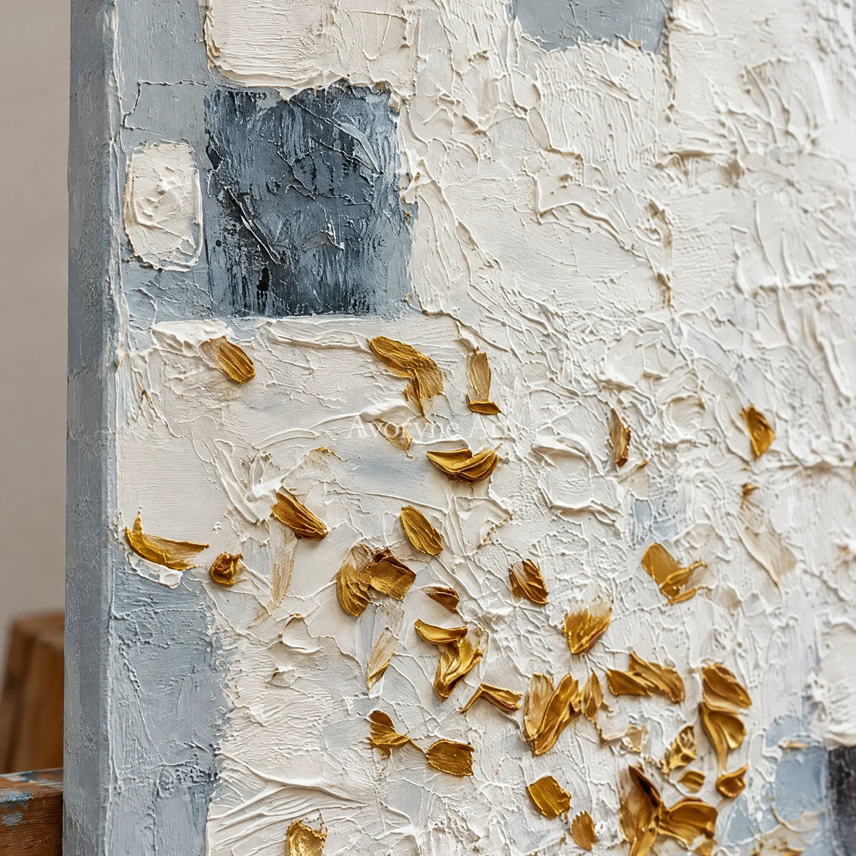 Close-up of the hand-painted texture of Lucent Refrain ivory gold relief wall art on an easel