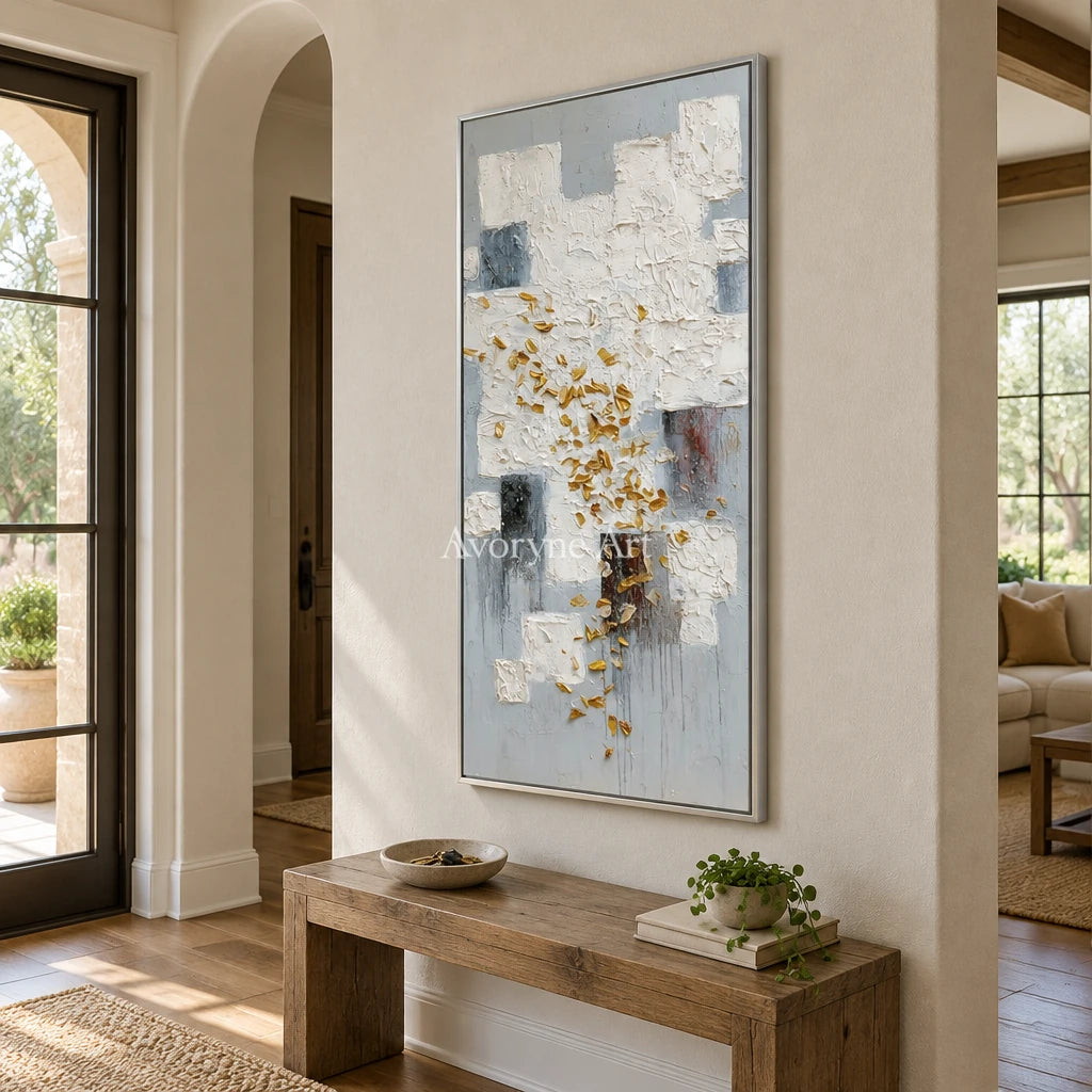 Lucent Refrain ivory gold relief wall art with a silver frame in an entryway