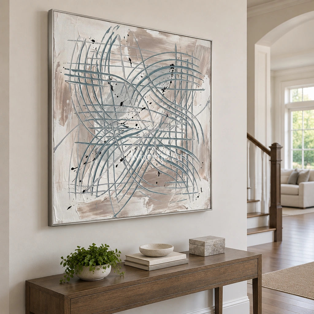 Golden Story linear abstract wall art with a silver frame in an entryway