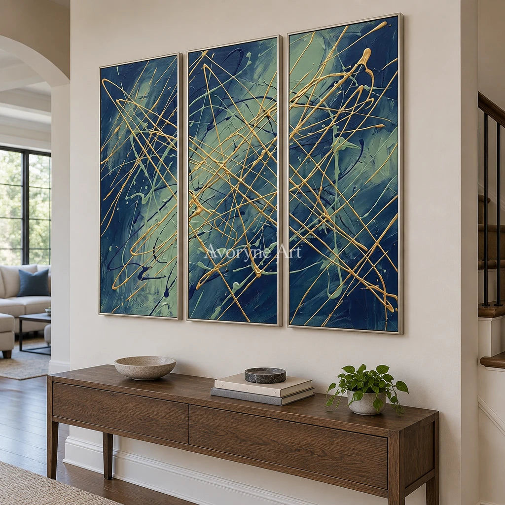Silver Vista linear abstract triptych with a silver frame in an entryway