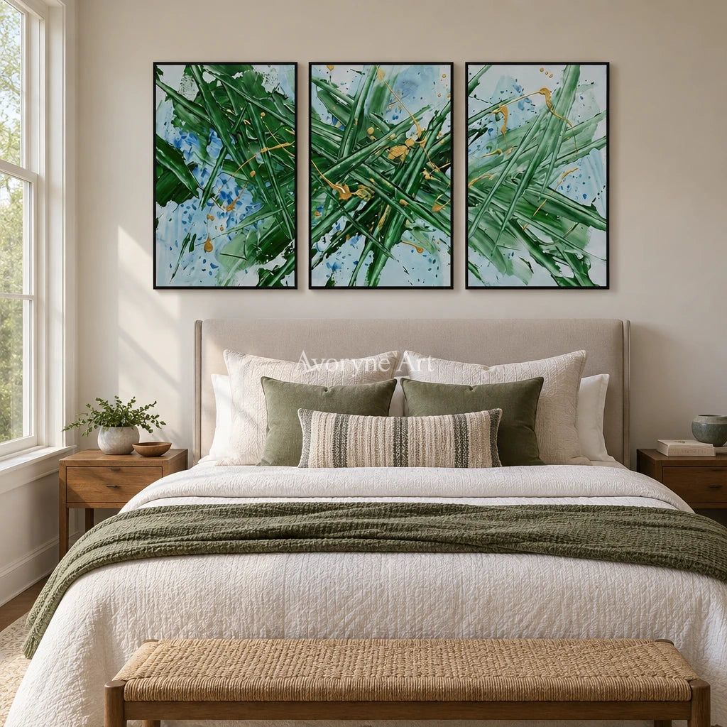 Golden Memory linear abstract triptych with a black frame above a bed in a bedroom