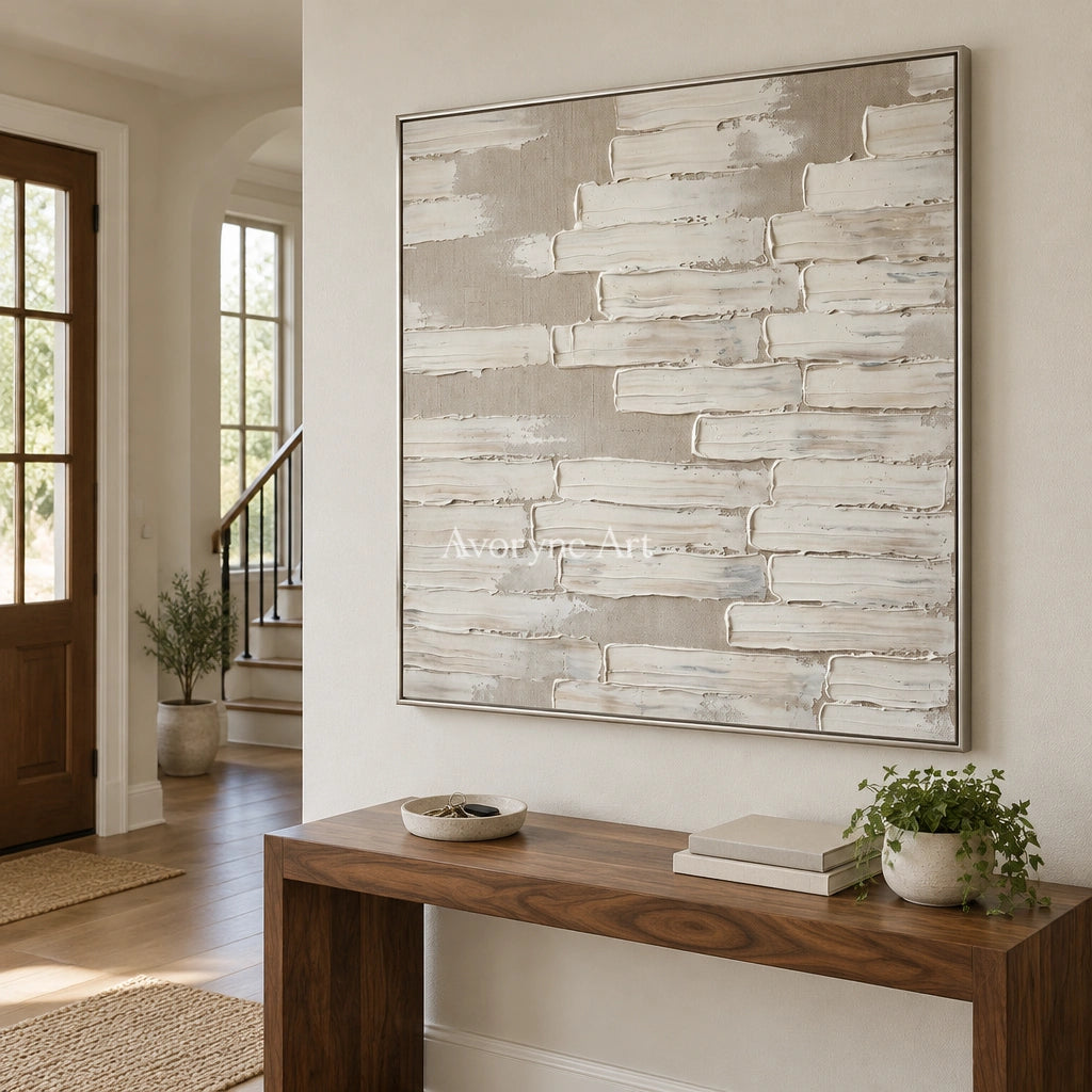 Misted Cadence neutral block relief wall art with a silver frame in an entryway