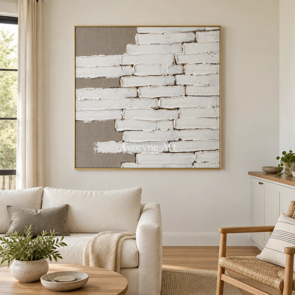 Misted Gesture neutral block relief wall art with a gold frame hanging in a living room