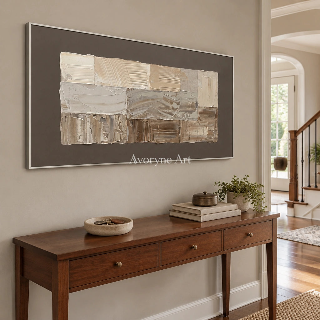 Hushed Interval neutral geometric relief wall art with a silver frame in an entryway