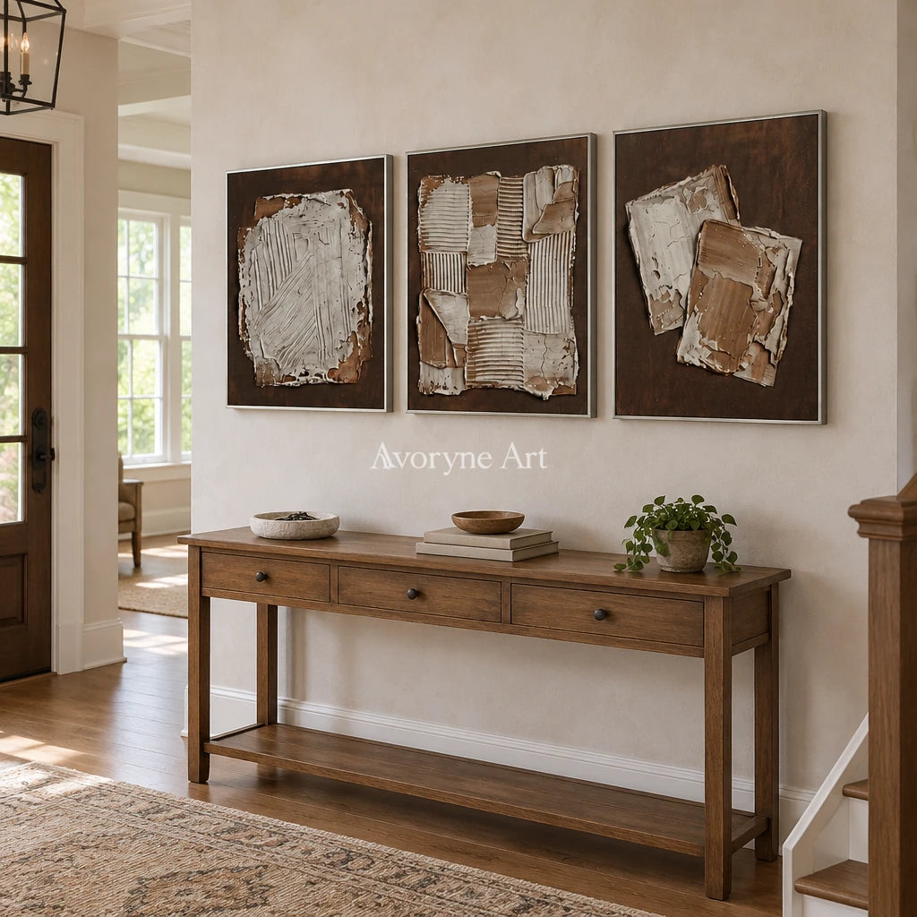 Soft Sonata neutral geometric relief triptych with a silver frame in an entryway