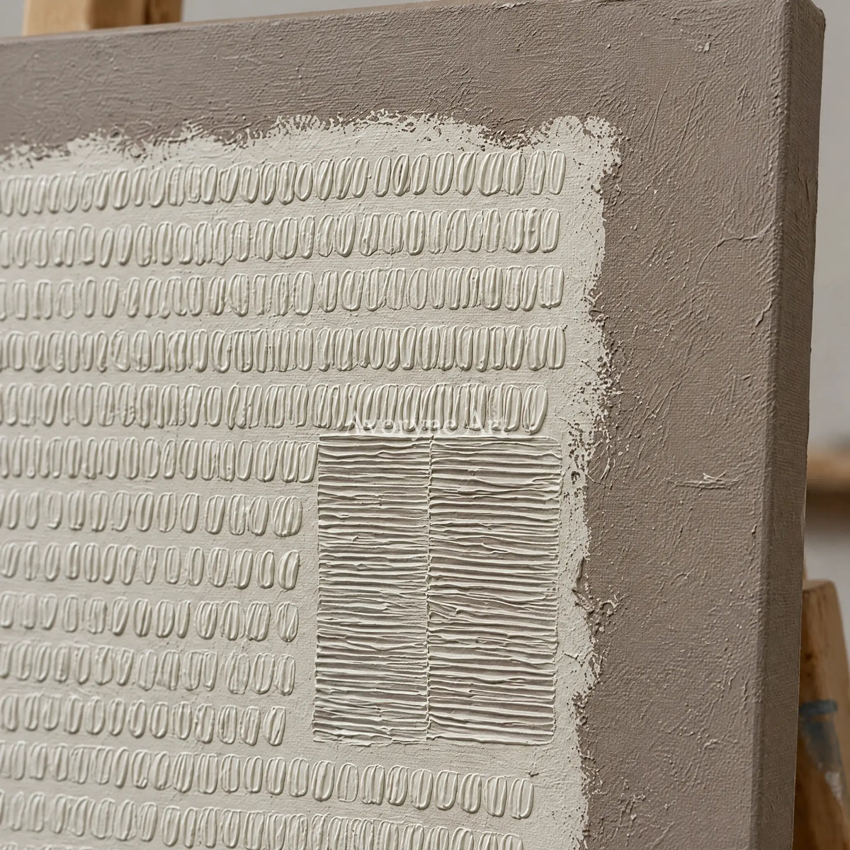 Close-up of the hand-painted texture of Woven Mosaic neutral grid texture wall art on an easel