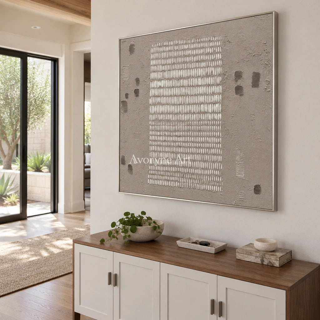 Woven Memory neutral grid texture wall art with a silver frame in an entryway