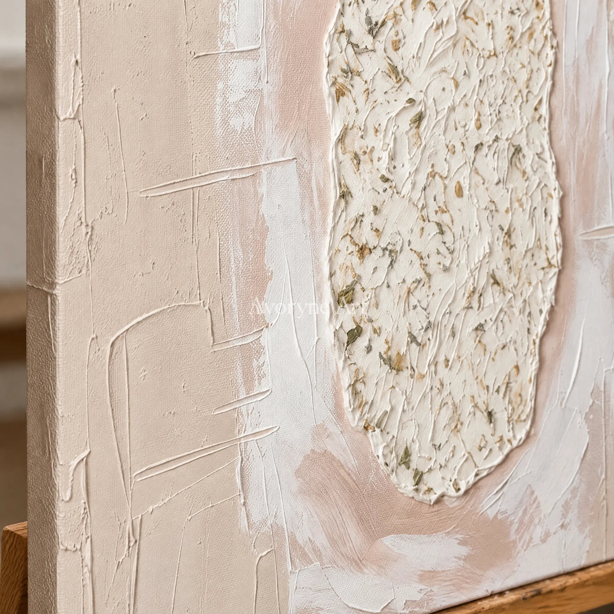 Close-up of the hand-painted texture of Weathered Rhythm neutral layered relief wall art on an easel