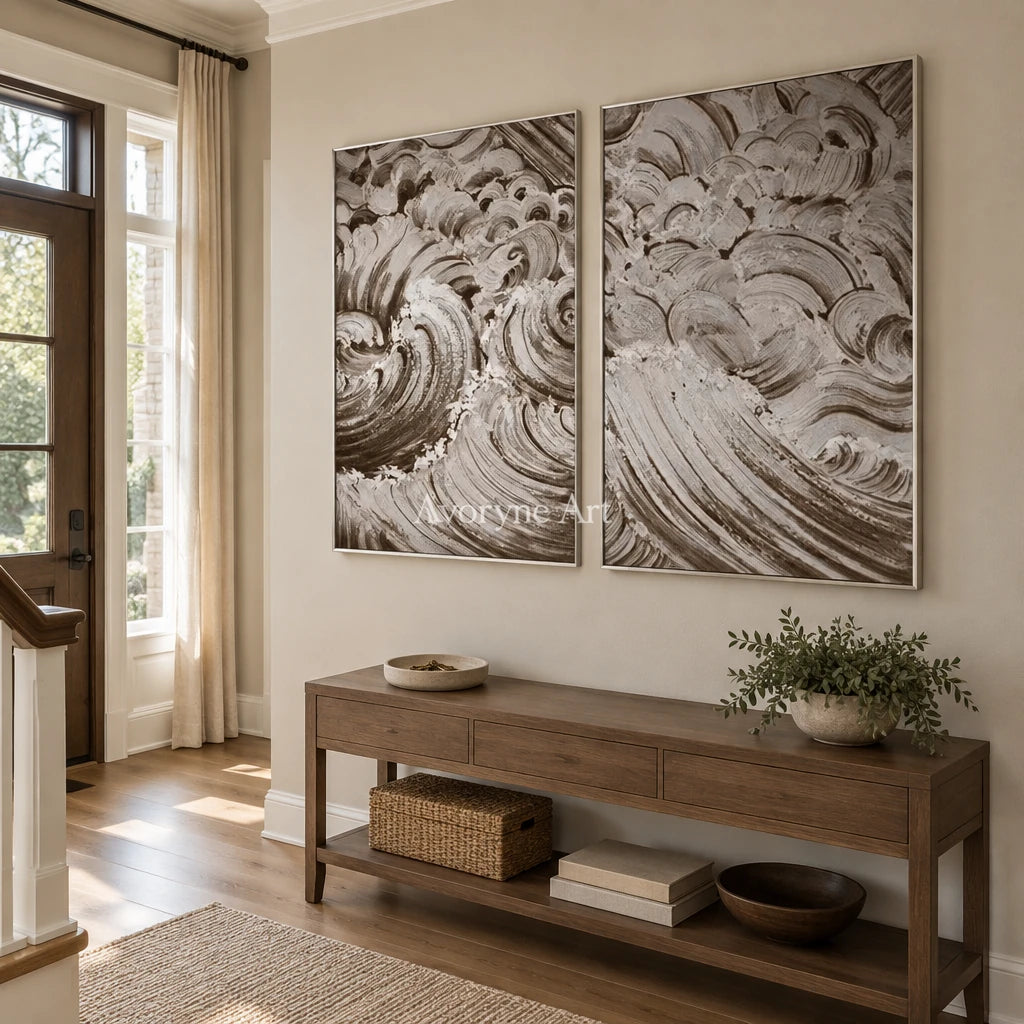 Muted Interval neutral wave relief diptych with a silver frame in an entryway