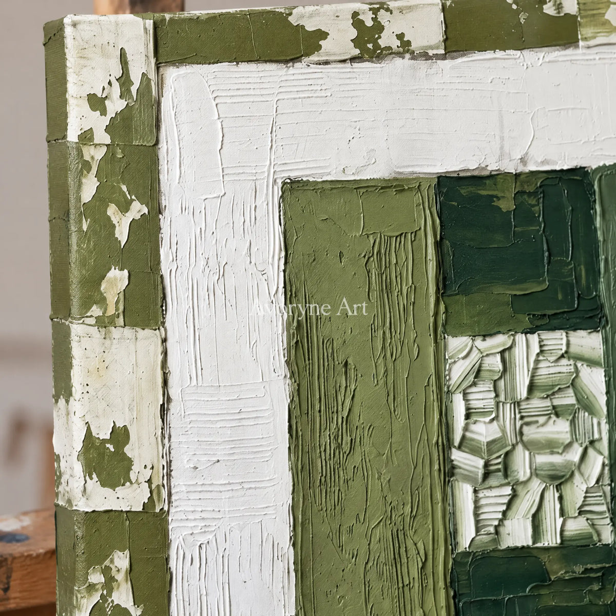 Close-up of the hand-painted texture of Hushed Haven olive ivory grid wall art on an easel