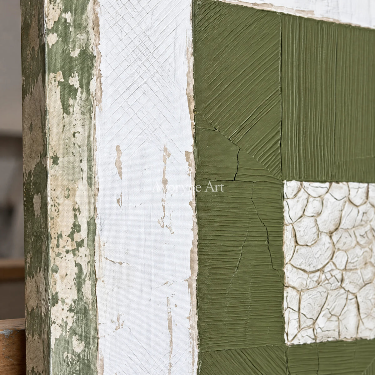 Close-up of the hand-painted texture of Mineral Drift olive ivory grid wall art on an easel